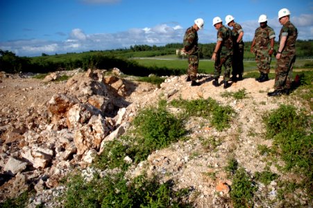US Navy 071201-N-7367K-003 Seabees with U.S. Naval Mobile Construction Battalion (NMCB) 1, Guam Det., and the 30th Naval Construction Regiment examine the Orote Point rock quarry on board Naval Base Guam