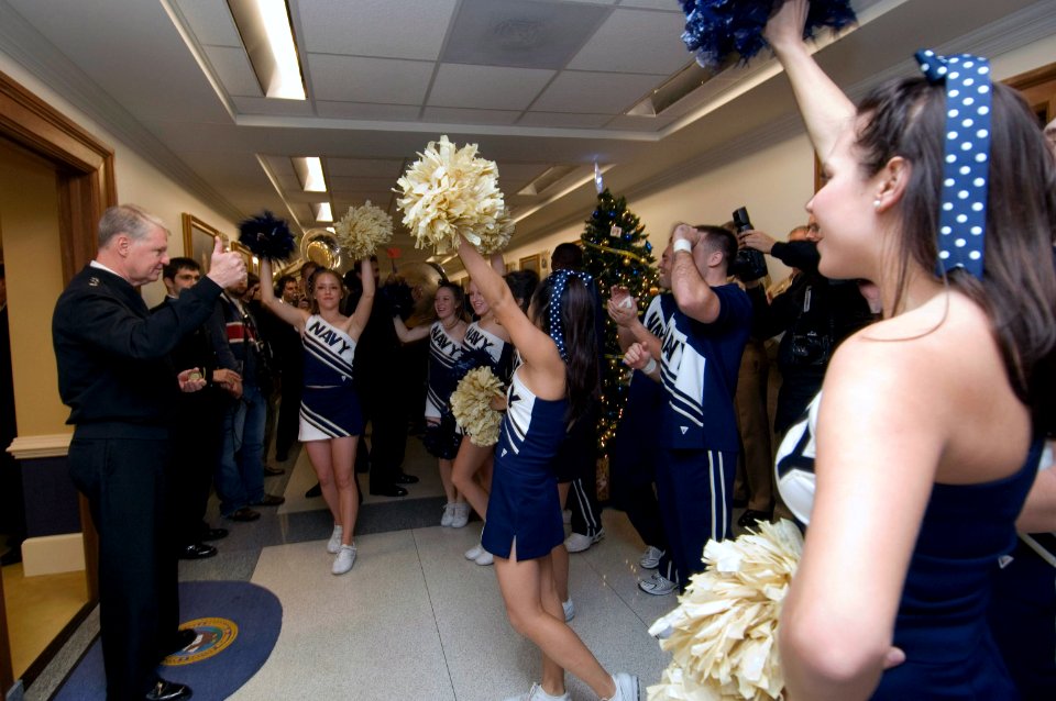 US Navy 071129-N-8273J-019 Chief of Naval Operations (CNO) Adm. Gary Roughead gives a thumbs up to U.S. Naval Academy cheerleaders and band performing during a pep rally in the Pentagon prior to the upcoming Army-Navy game