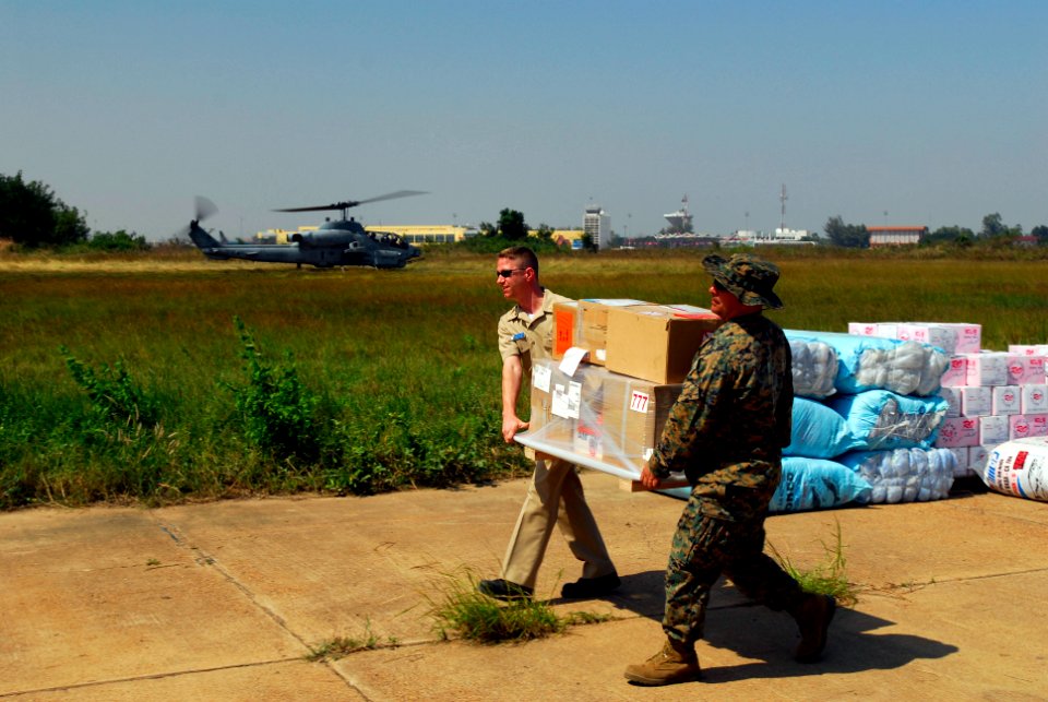 US Navy 071128-N-4010S-198 Chief Postal Clerk (SW-AW) Mike Kinstle, assigned to the amphibious assault ship USS Essex (LHD 2) and Gunnery Sgt. Ronald Delatte, assigned to the Command Element of the 31st Marine Expeditionary Uni