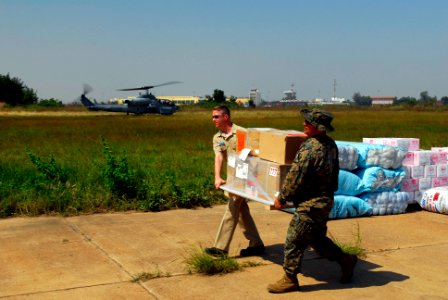 US Navy 071128-N-4010S-198 Chief Postal Clerk (SW-AW) Mike Kinstle, assigned to the amphibious assault ship USS Essex (LHD 2) and Gunnery Sgt. Ronald Delatte, assigned to the Command Element of the 31st Marine Expeditionary Uni
