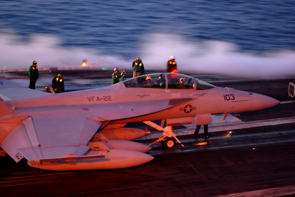 US Navy 071202-N-3659B-092 The aircrew of an F-A-18F Super Hornet, assigned to VFA 22, wait to launch from USS Ronald Reagan (CVN-76)