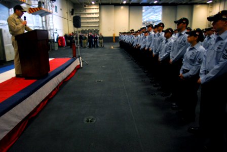US Navy 071203-N-7526R-048 Capt. Terry Kraft, commanding officer of USS Ronald Reagan (CVN 76), addresses Sailors in formation during a frocking ceremony in the hangar bay of the Nimitz-class nuclear-powered aircraft carrier