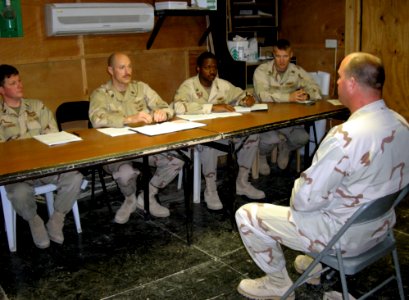 US Navy 071202-N-9643K-022 Aviation Electronics Technician 1st Class James Taylor, assigned to Fleet Composite Squadron (VC) 6, answers questions as part of the Sailor of the Year screening process