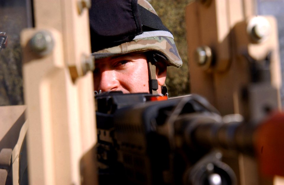 US Navy 071130-N-4198C-002 Builder 2nd Class Joseph Milauckas, a Seabee attached to NMCB-3, mans a 240-machine gun on the turret of a mine resistant ambush protected vehicles at Fort Hunter Liggett