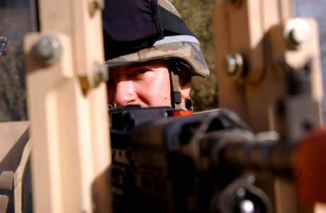 US Navy 071130-N-4198C-002 Builder 2nd Class Joseph Milauckas, a Seabee attached to NMCB-3, mans a 240-machine gun on the turret of a mine resistant ambush protected vehicles at Fort Hunter Liggett
