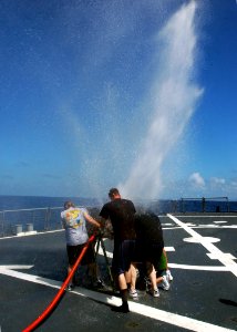 US Navy 071130-N-4014G-115 Sailors aboard the guided-missile destroyer USS Porter (DDG 78) conduct a pipe patching exercise on the flight deck during Porter's Damage Control Olympics
