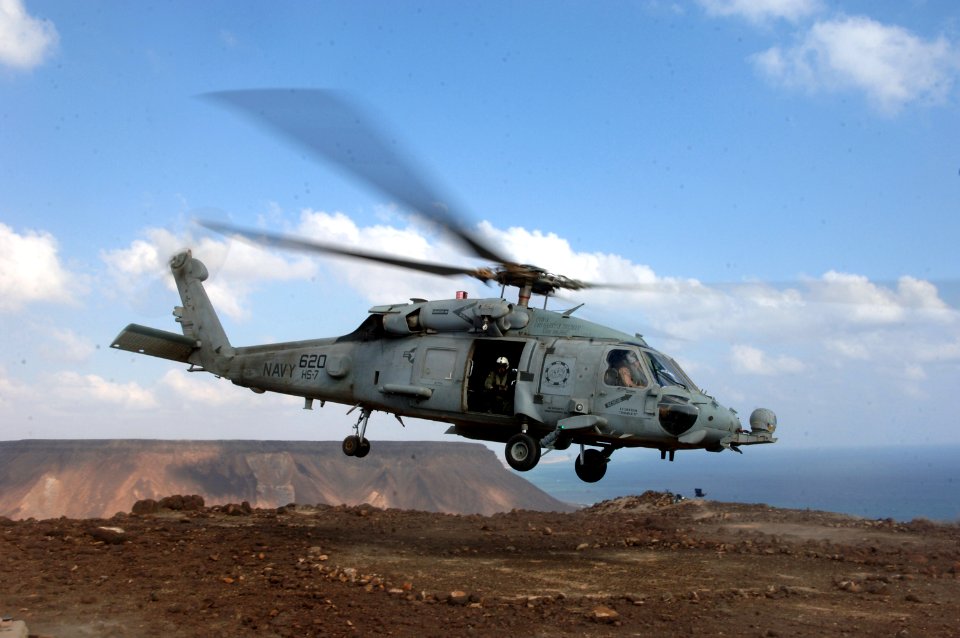 US Navy 071204-N-3931M-033 Service members aboard a HH-60H Seahawk from Helicopter Anti-submarine squadron (HS) 7, assigned to Carrier Air Wing (CVW) 3 aboard USS Harry S. Truman (CVN 75), provides logistic support for Combined