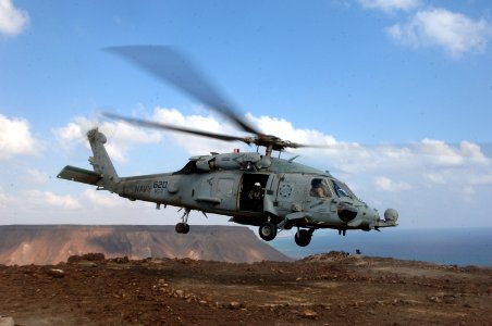 US Navy 071204-N-3931M-033 Service members aboard a HH-60H Seahawk from Helicopter Anti-submarine squadron (HS) 7, assigned to Carrier Air Wing (CVW) 3 aboard USS Harry S. Truman (CVN 75), provides logistic support for Combined