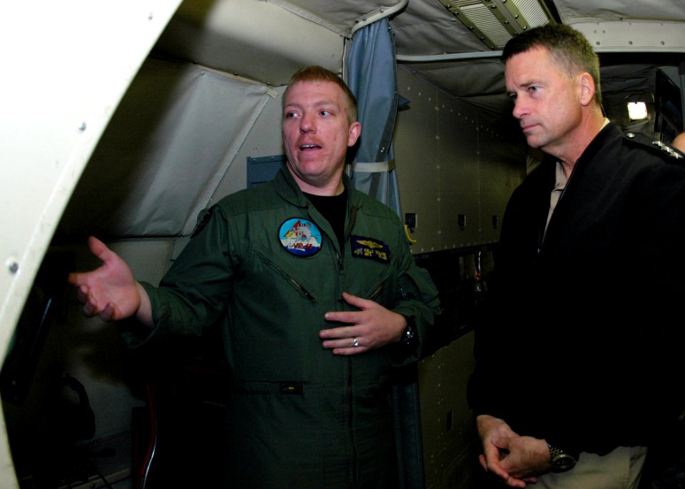 US Navy 071204-N-0577G-005 Aviation Warfare Systems Operator 3rd Class Kelly Squire, assigned to Patrol Squadron (VP) 45, explains the different equipment operated from the radar console of the P-3 Orion