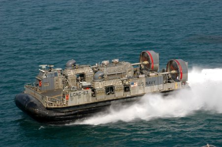 US Navy 071129-N-5642P-066 A landing craft-air cushion, from Assault Craft Unit (ACU) 4, attached to amphibious assault ship USS Kearsarge (LHD 3), rides alongside Kearsarge for a demonstration