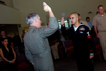 US Navy 071129-N-5821P-001 Religious Program Specialist 1st Class Rafael Barney is reenlisted by Rear Adm. Michael Groothousen, commander of Navy Region Europe (CNRE), during the admiral's site visit to Naval Air Station (NAS)