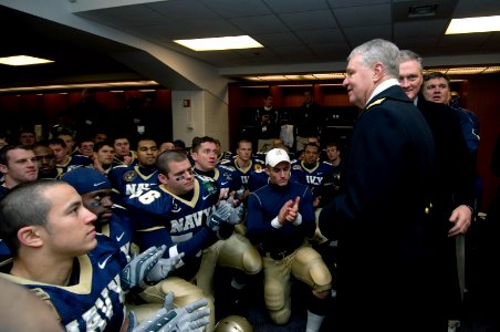 US Navy 071201-N-8273J-230 Chief of Naval Operations (CNO) Adm. Gary Roughead congratulates the U.S. Naval Academy team following a 38-3 victory over the Black Knights of the Army. The 108th Army-Navy football game was held at