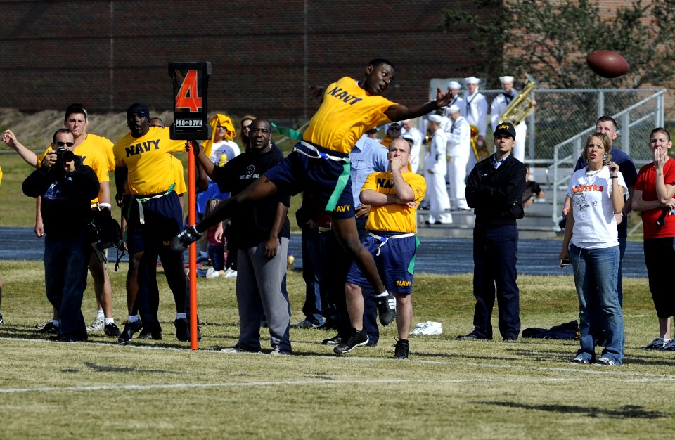 US Navy 071201-N-5328N-590 U.S. Navy flag football wide receiver Seaman Lawrence Duncan stretches to catch a wild pass to make fourth down during the fifth annual CID Corry Station Flag Football Game at Corry Station