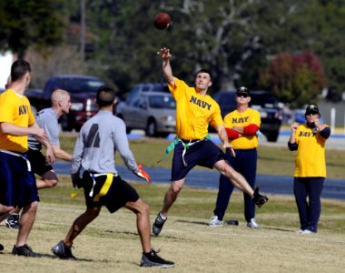 US Navy 071201-N-5328N-589 Quarterback and Cryptologic Technician (Technical) 1st Class Jakob Chauvin passes the ball during the fifth annual CID Corry Station Flag Football Game at Corry Station