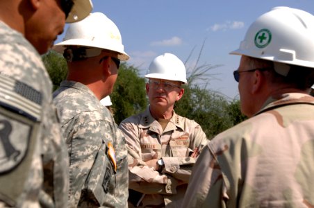 US Navy 071130-N-1003P-022 Vice Adm. Robert Moeller, deputy to the commander for Civil-Military Operations for U.S. Africa Command, listens to Sgt. 1st Class William Brown, talk about the Carta Well