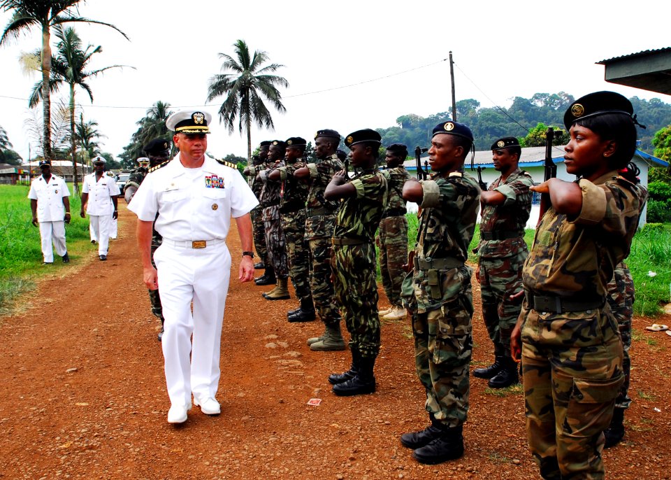 US Navy 071204-N-8933S-058 Cameroonian sailors salute Capt. John B. Nowell Jr., commodore, Africa Partnership Station (APS), on the departure from Limbe Naval Base after discussions of training and construction projects