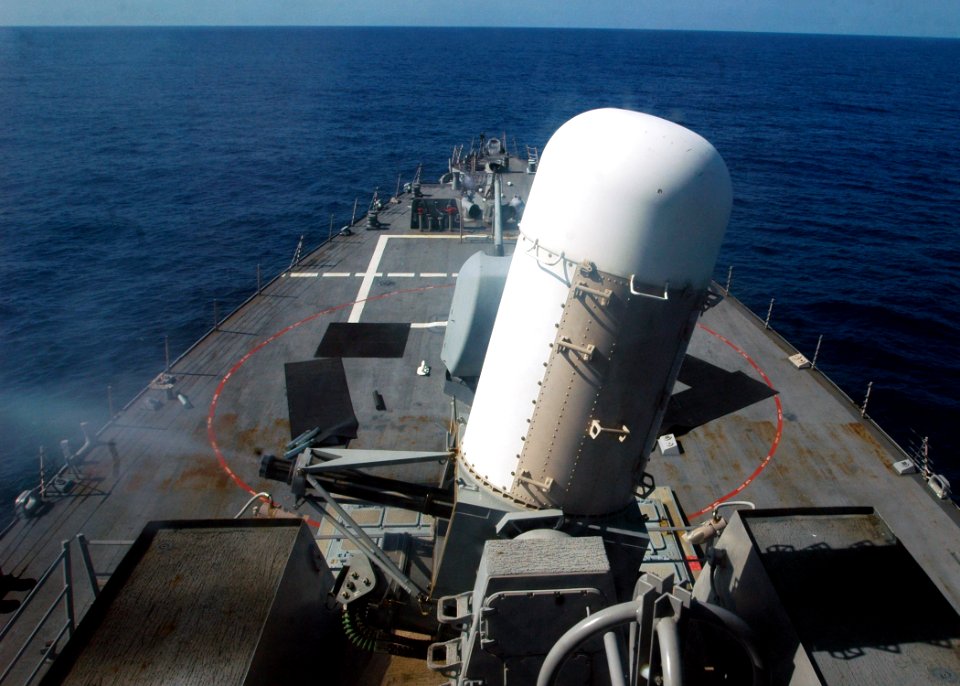 US Navy 071203-N-4014G-019 The forward Close-In Weapons System (CIWS) mount fires a volley of rounds during a live-fire exercise aboard the guided-missile destroyer USS Porter (DDG 78)