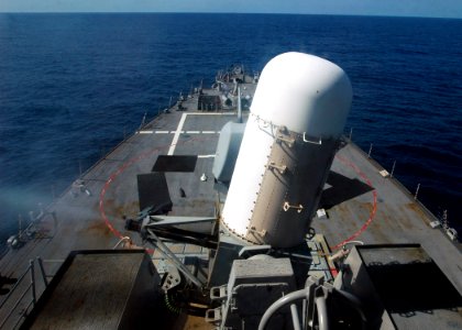 US Navy 071203-N-4014G-019 The forward Close-In Weapons System (CIWS) mount fires a volley of rounds during a live-fire exercise aboard the guided-missile destroyer USS Porter (DDG 78) photo
