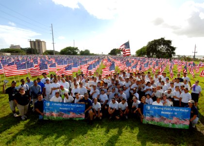 US Navy 071205-N-5476H-044 Students from the Hawaii National Guard Youth Challenge Academy and volunteers from the Hawaii Job Corp pose for a group photo after placing ribbons and flags for the Healing Field Flag Memorial