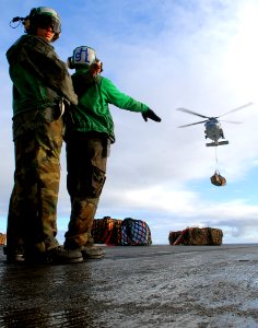 US Navy 071208-N-8132M-064 Sailors aboard the nuclear-powered aircraft carrier USS Enterprise (CVN 65), direct an HH-60H Seahawk helicopter