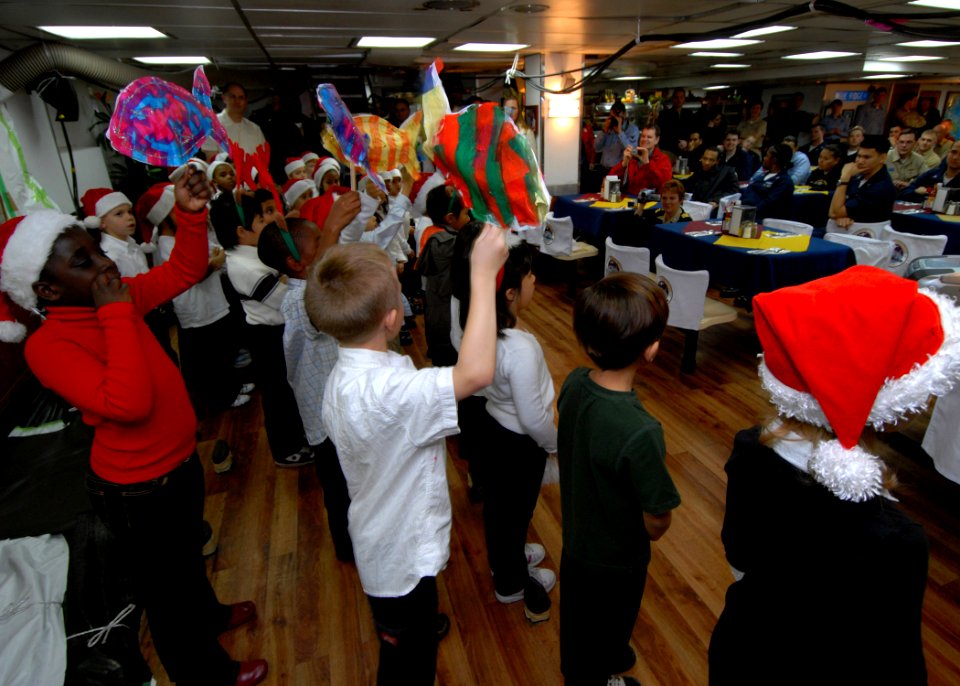 US Navy 071210-N-4399G-169 Students from Ikego Elementary School's Spanish-immersion first and second grade classes visit the amphibious command ship USS Blue Ridge (LCC 19) and 7th Fleet Sailors to sing Spanish-influenced Chri