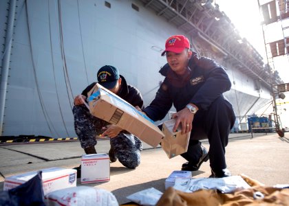 USS Bonhomme Richard (LHD 6) Mail Call 170103-N-TH560-001