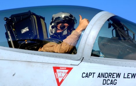 US Navy 071211-N-8923M-048 A naval aviator gives a thumbs up as he gets ready for flight operations aboard the Nimitz-class nuclear-powered aircraft carrier USS Harry S. Truman (CVN 75) photo