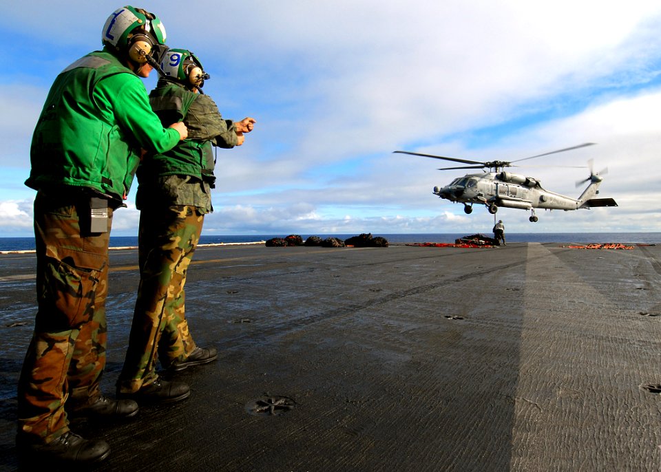 US Navy 071208-N-8132M-127 Sailors aboard the nuclear-powered aircraft carrier USS Enterprise (CVN 65), direct an HH-60H Seahawk helicopter
