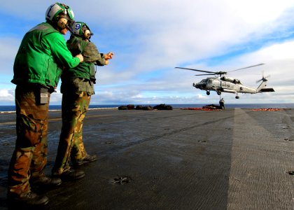 US Navy 071208-N-8132M-127 Sailors aboard the nuclear-powered aircraft carrier USS Enterprise (CVN 65), direct an HH-60H Seahawk helicopter