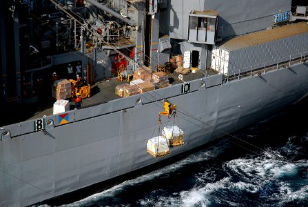 US Navy 071209-N-4774B-092 Materials are transported by a cargo stream rig between the Military Sealift Command (MSC) combat stores ship USNS Concord (T-AFS 5) and the amphibious assault ship USS Tarawa (LHA 1)