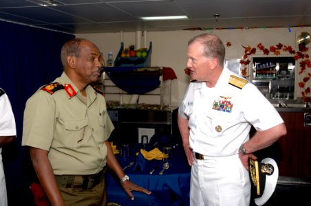 US Navy 071215-F-0509T-016 Rear Adm. James Hart, commander, Combined Joint Task Force-Horn of Africa, and Djiboutian Army Brig. Gen. Osman Soubagleh, director of international relations, meet for a reception at end the Operatio photo