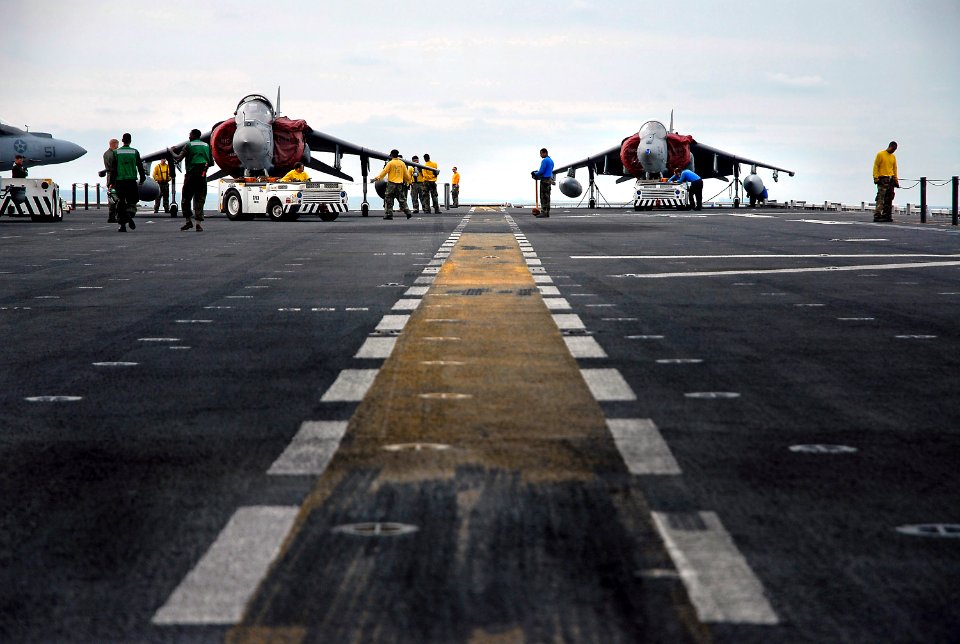 US Navy 071211-N-4774B-020 On the flight deck of amphibious assault ship USS Tarawa (LHA 1), personnel prepare to move aircraft into the hangar bay for the up coming STUFFEX exercise