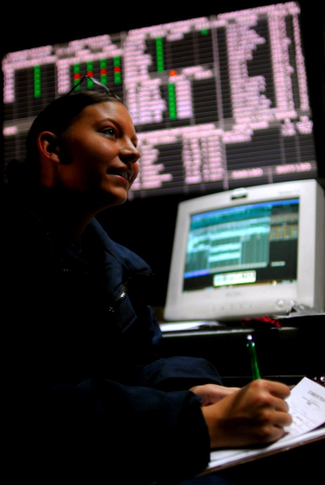 US Navy 071209-N-7526R-472 Air Traffic Controller Airman Apprentice Samantha Rablin gathers information for a flight-status board while standing watch in the air operations center aboard the Nimitz-class nuclear-powered aircraf