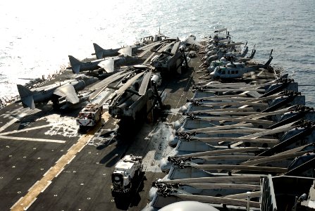 US Navy 071209-N-4774B-098 Aircraft are staged forward on the flight deck aboard the amphibious assault ship USS Tarawa (LHA 1) during a replenishment at sea