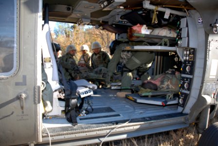 US Navy 071211-N-9623R-006 Seabees from Naval Mobile Construction Battalion (NMCB) 17 assist in loading fellow Seabees into a Blackhawk medical evacuation helicopter (MEDAVAC) during a mass casualty drill
