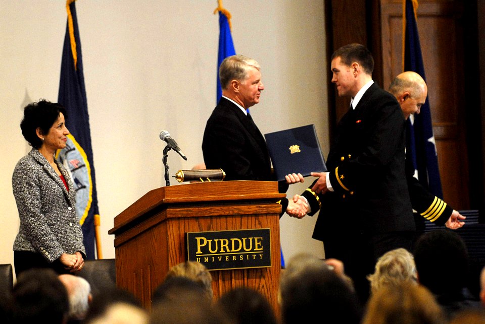 US Navy 071217-N-8273J-167 Chief of Naval Operations (CNO) Adm. Gary Roughead congratulates Ensign Joshua Fleming during a tri-service Reserve Officer Training Corps (ROTC) commissioning ceremony at Purdue University