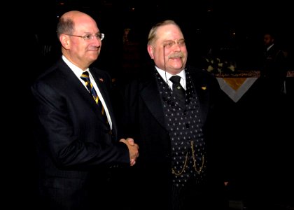 US Navy 071215-N-7241L-014 Secretary of the Navy, the Honorable Donald C. Winter, poses for a photo with James Foote, an actor who portrays Theodore Roosevelt