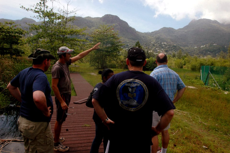 US Navy 071218-N-4014G-105 Michael Dale, the Wetlands Manager of the Roche Caiman Bird Sanctuary, gives a tour to community relations project volunteers