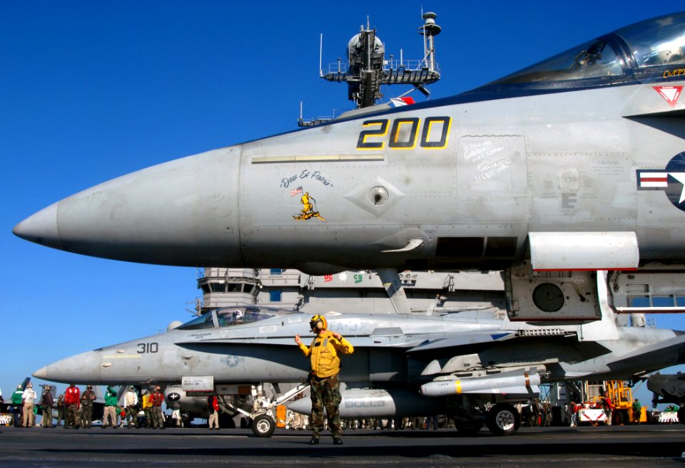 US Navy 071211-N-2984R-004 An F-A-18 Hornet and an F-A-18F Super Hornet prepare to launch off the flight deck aboard the nuclear-powered aircraft carrier USS Harry S. Truman (CVN 75)