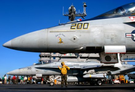 US Navy 071211-N-2984R-004 An F-A-18 Hornet and an F-A-18F Super Hornet prepare to launch off the flight deck aboard the nuclear-powered aircraft carrier USS Harry S. Truman (CVN 75)