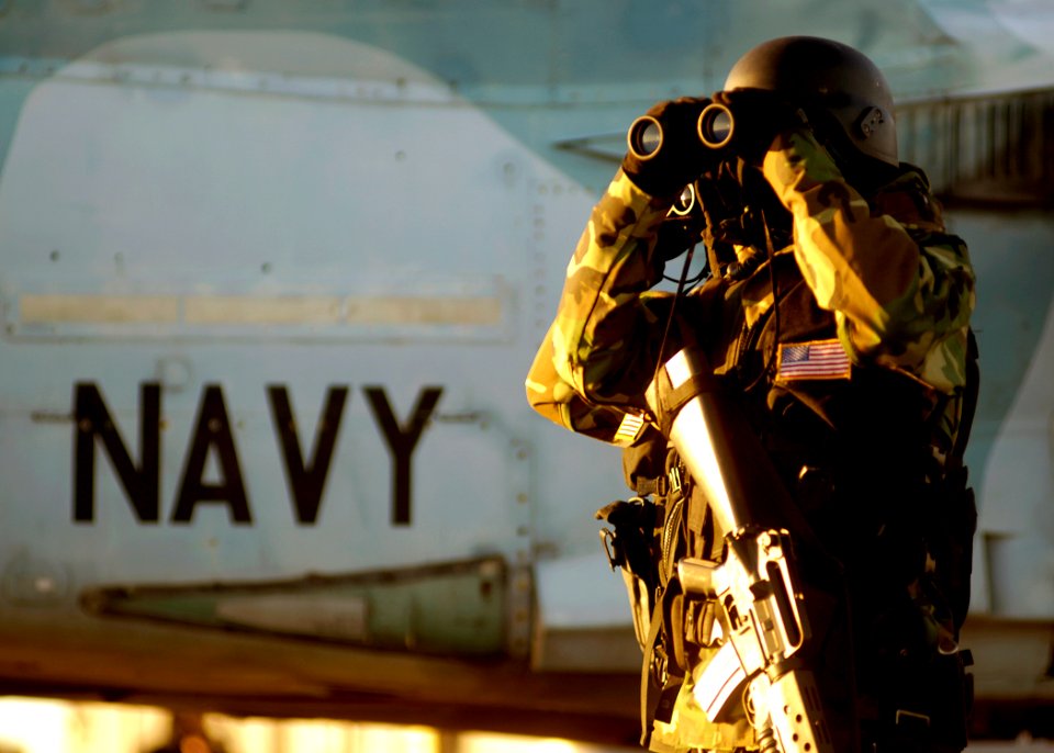 US Navy 071217-N-7241L-005 Aviation Ordnanceman 3rd Class Ken Barriere stands watch as part of the nuclear-powered aircraft carrier USS Theodore Roosevelt's (CVN 71) force protection detail as she transits the mouth of the Ches