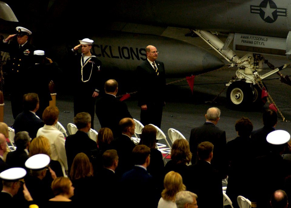 US Navy 071215-N-7571S-008 Secretary of the Navy, the Honorable Donald C. Winter enters hangar bay two for the start of the Great White Fleet Ceremony aboard USS Theodore Roosevelt (CVN 71)