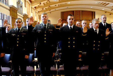 US Navy 071217-N-8273J-140 During a tri-service commissioning ceremony, 35 Purdue University graduates take the oath in becoming commissioned officers