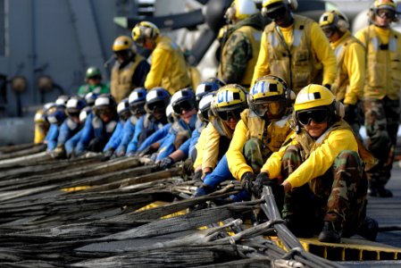 US Navy 071217-N-8923M-105 Sailors assigned to Air Department aboard the Nimitz-class aircraft carrier USS Harry S. Truman (CVN 75) set up an aircraft barricade during flight deck drills