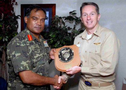 US Navy 071218-N-3925A-004 Capt. Billy Hart, commanding officer, USS Cleveland (LPD 7) presents a plaque to Brig. Gen. Moosa Ali Jaleel, Commanding General of Maldives National Defense Force's Quick Reaction Force