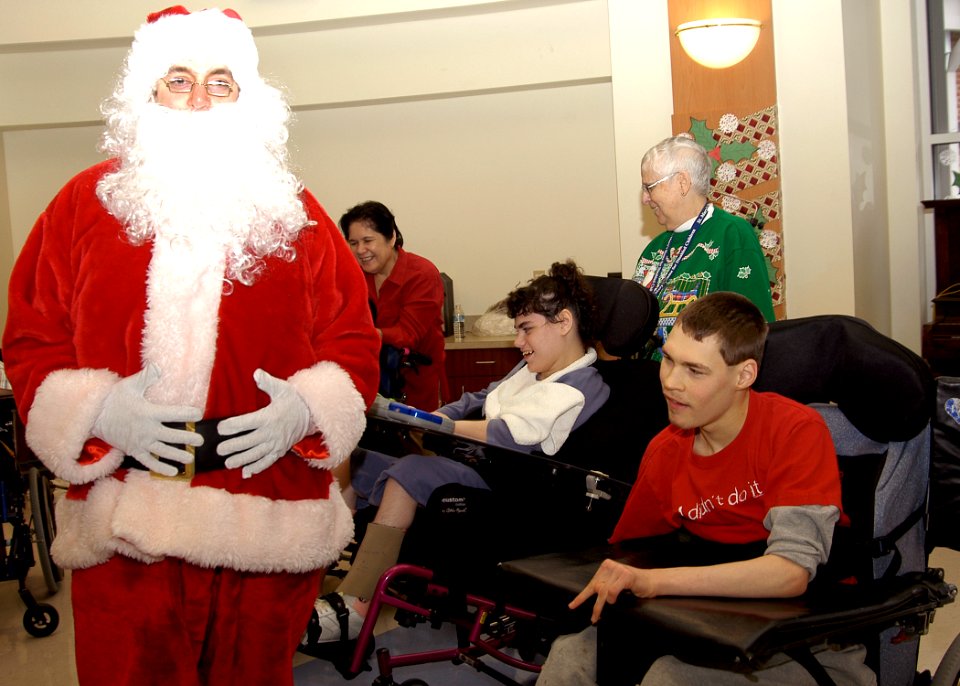US Navy 071226-N-4669J-021 Aviation Electrcian's Mate 1st Class Jeff Dietz, dressed as Santa, visits with children at the St. Mary's Home for Disabled Children