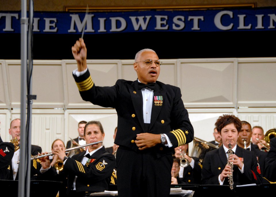 US Navy 071219-N-0773H-036 Capt. George N. Thompson conducts the Navy Band in the playing of the National Anthem at the 61st annual Midwest Clinic