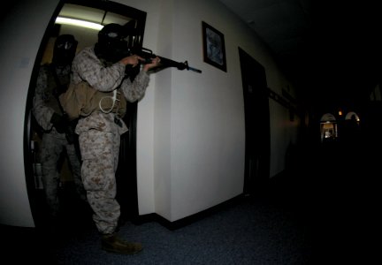 US Navy 071227-N-4097B-044 U.S. Marines assigned to the Fleet Anti-terrorism Security Team onboard Naval Support Activity (NSA) Bahrain search for possible insurgents during an emergency response exercise