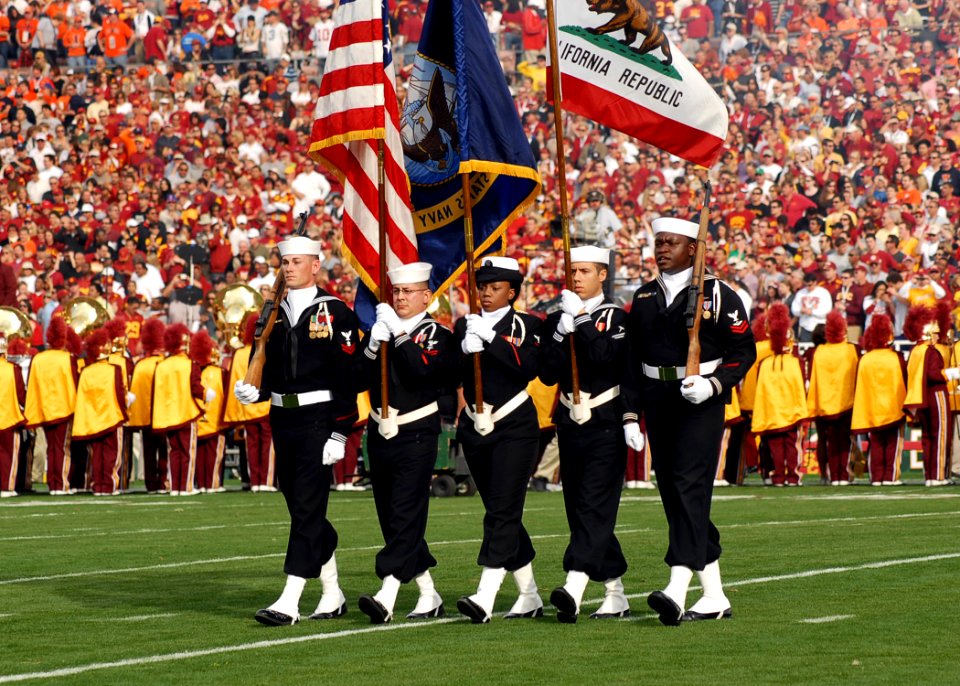 US Navy 080101-N-8607R-062 The Naval Base Ventura County Honor Guard parades the colors as the University of Southern California Marching Band performed the national anthem during the 2008 Rose Bowl game