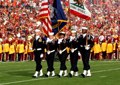 US Navy 080101-N-8607R-062 The Naval Base Ventura County Honor Guard parades the colors as the University of Southern California Marching Band performed the national anthem during the 2008 Rose Bowl game